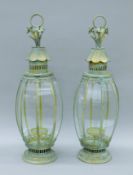 A pair of verdigris lanterns. Each 70 cm high.