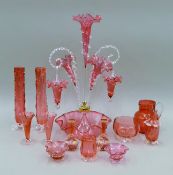 A quantity of Victorian cranberry glass, including an epergne. The latter 55 cm high.