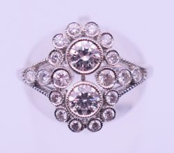 An Art Deco 18 ct white gold diamond ring. Ring size N.