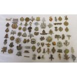 Collection of mostly British military army cap badges, pin badges etc, to incl. RAF, 52nd Regiment