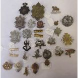 Collection of mostly British military army cap badges, pin badges etc, to incl. West Yorkshire
