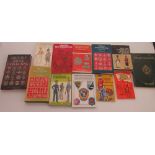 Collection of military reference books, including badges of the British Army, uniforms of the