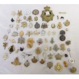 Collection of mostly British military cap badges, pin badges etc, to incl. Green Howards, Queen's