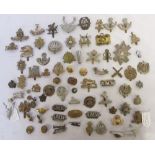 Collection of mostly British military army cap badges, pin badges etc, to incl. Physical Training