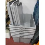 Seven large plastic storage crates with lids 59 x 79cm.