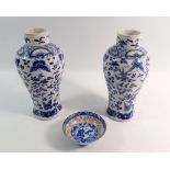 A pair of Chinese blue and white baluster vases decorated birds, butterflies and flowers, four