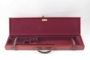 A good Brady leather gun case with claret baize lined fitted interior for 30 ins barrels In vgc
