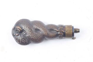 Brass pistol powder flask with entwined scaled fish, 5 ins overall decoration