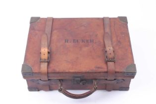 A tan leather cartridge magazine with brass corners and capacity for approx. 250 cases, Cogswell &