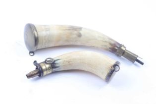 Two horn powder flasks one with Irish pattern mounts stamped B 10, two suspension rings and brass