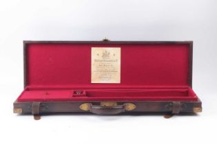 Leather case with brass corners, red baize lined interior fitted for 28 ins barrels, later Westley