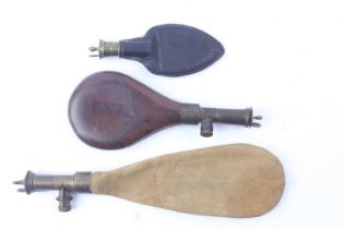 Three Irish pattern shot flasks with brass fitments, large suede bag; round leather and leather