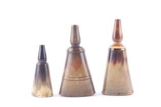 Three oval horn powder flasks with screw tops Good
