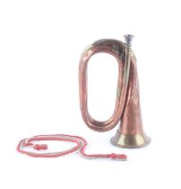 Copper and brass bugle with mouthpiece retaining chain and coloured bindings Numerous dents and