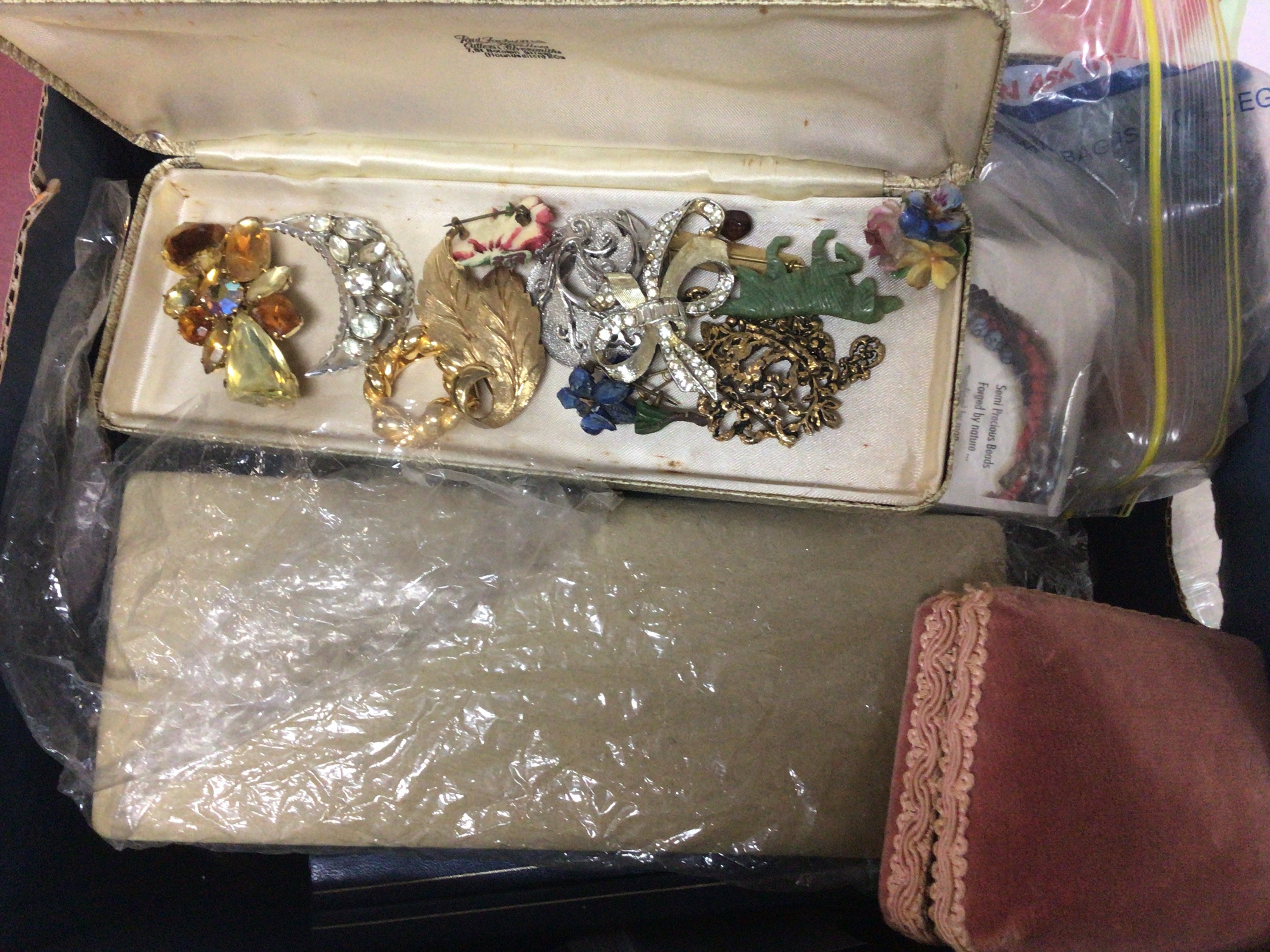 A box containing costume jewellery including some