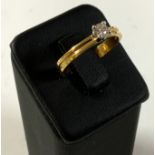 A good quality 18ct double band design 0.23ct soli