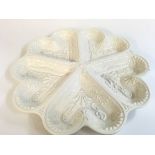 A decorative salt plate 32cm wide. No reserve