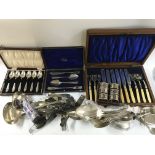 A collection of silver plated cutlery including kn