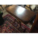 An inlaid regency style card table with a green le