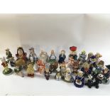 A collection of porcelain wade figures including A