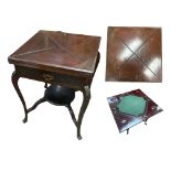 An Edwardian walnut envelope card table. 57cm x 57