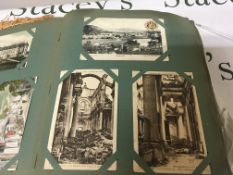 An early 20th century postcard album containing a