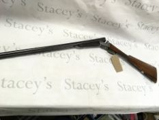 A Woodward and sons aide by side 12g shotgun. 27in