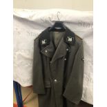 A German Third Reich officers overcoat M52 badged