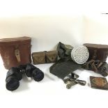 A collection of various military items including a