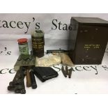 Ammunition tin, old shell cases, smoke grenades etc. Shipping category D.