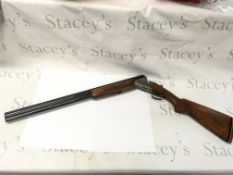 A 12g Rizzini over under shotgun. Single trigger.