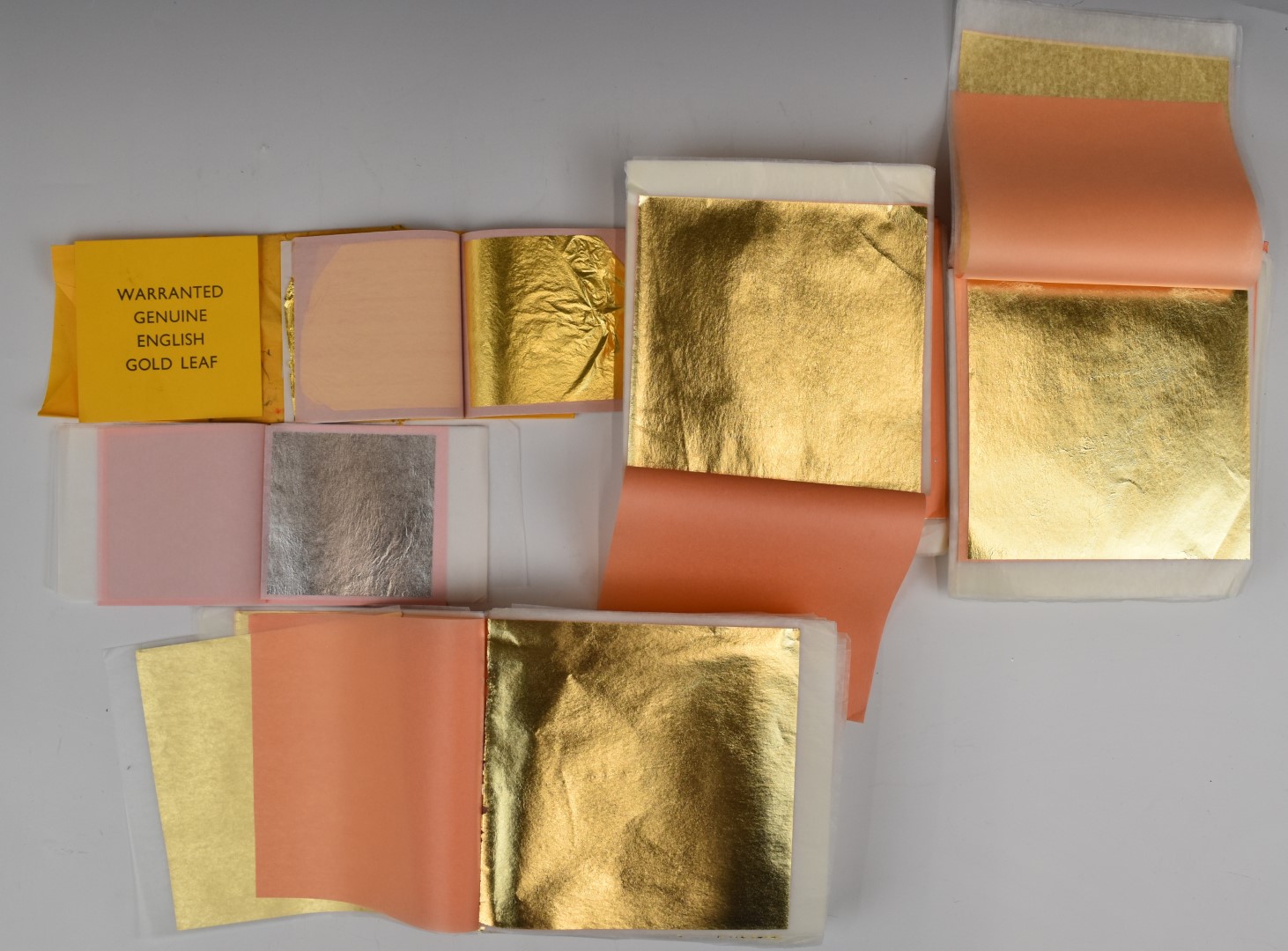 Forty three books of gold leaf transfer with approximately 24 sheets per book, sheets measure 13 x