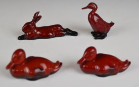 Four Royal Doulton flambé animals comprising three ducks and a hare, tallest 6cm