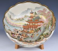 Japanese Satsuma pedestal bowl with figural decoration and wooden stand, diameter 30 x height 12.