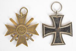 German WW1 Iron Cross second class and a WW2 German Nazi Third Reich War Merit Cross with crossed