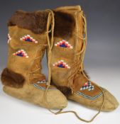 American pair of over calf height lace up moccasins, length of soles 28cm, three holes in left