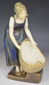 Ernst Wahliss Austrian pottery figure of an Austrian / Dutch girl with basket, H27cm
