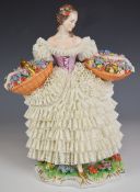 Sitzendorf figurine 'Flower Girl' with Dresden lace dress and two baskets of flowers, H26cm