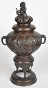 Chinese bronzed metal large censer with Dog of Fo finial and relief moulded decoration of birds,