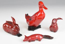 Four Royal Doulton flambé animals comprising duck, lop eared rabbit, slinking fox and hare,