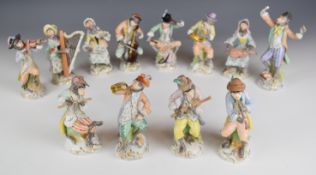 Dresden set of twelve monkey band figures, tallest 17cm