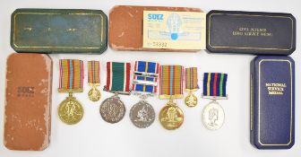Three unofficial medals comprising two Suez and National Service together with a Women's Voluntary