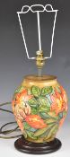 Moorcroft pedestal table lamp decorated in the Flame Of The Forest pattern, H33cm