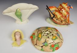 Art Deco ceramics including a Continental figural wall plaque, figural budgerigar vase, galleon