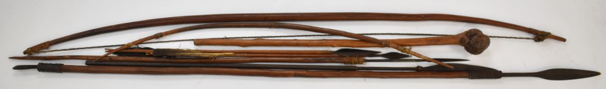 African tribal spears, bows, arrows and knobkerrie probably 19thC, largest 164cm
