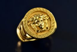 Versace 18ct gold ring depicting Medusa within a Greek key border and shoulders, 20.4g, size Z