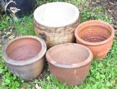Four jardinières / garden planters comprising three terracotta style and one with glazed finish in
