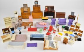 A collection of mid twentieth century dolls house furniture comprising metal, wooden and plastic