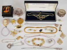 A silver gilt filigree bracelet, two brooches and two pairs of earrings, two silver necklaces, two