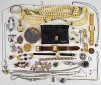 A collection of jewellery including three silver rings, one set with mother of pearl and